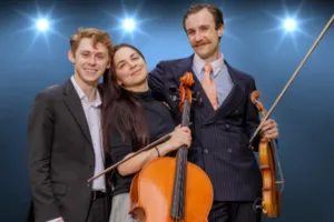 A trio of musicians holding string instruments