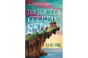 Book cover of The House in the Cerulean Sea which features a house perched on a cliff overlooking the sea with a colorful sky in the background.