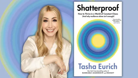 Author pictured next to her book.